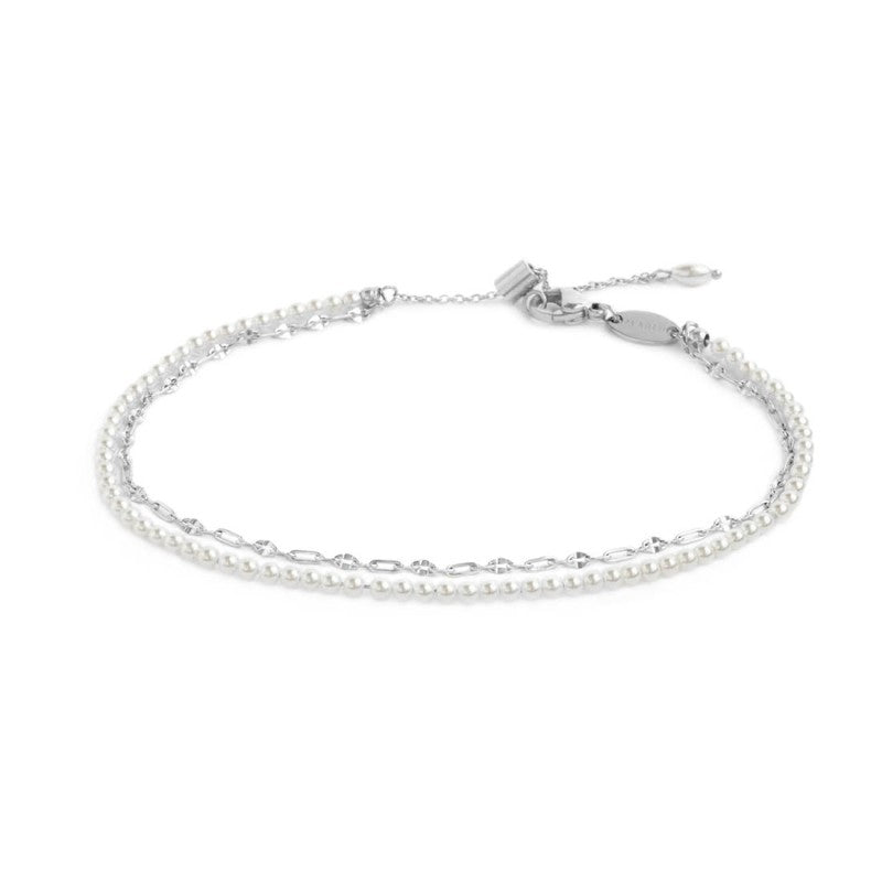 Cavigliera doppia catena con perle bianche e lip-cable