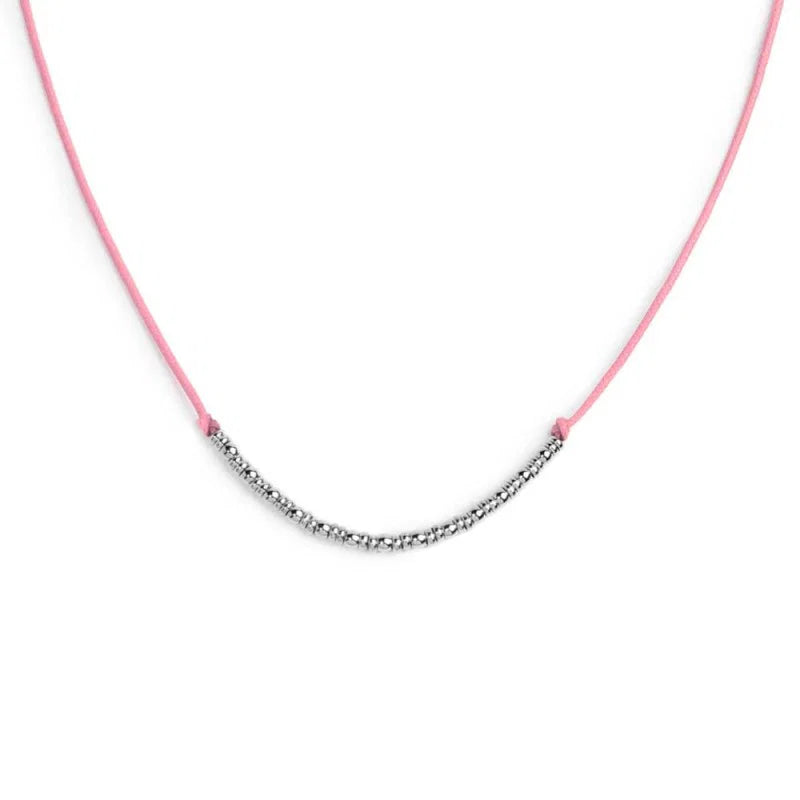 Collana cordino con sfere e rondelle al centro