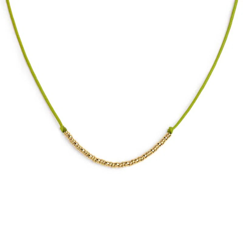 Collana cordino con sfere e rondelle al centro