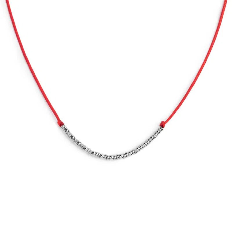 Collana cordino con sfere e rondelle al centro