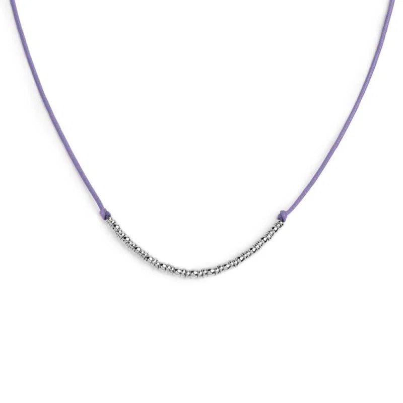 Collana cordino con sfere e rondelle al centro