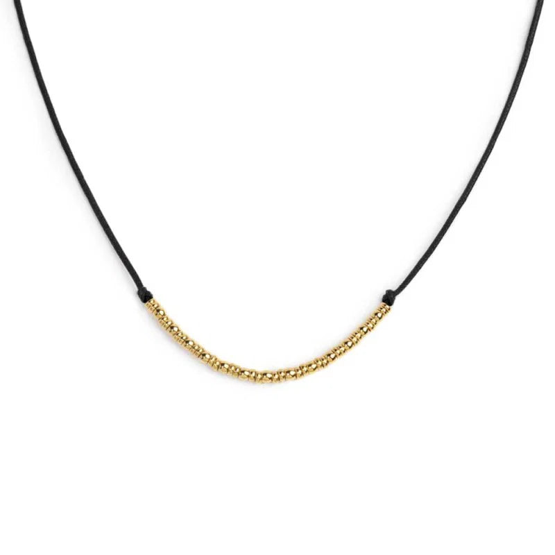 Collana cordino con sfere e rondelle al centro